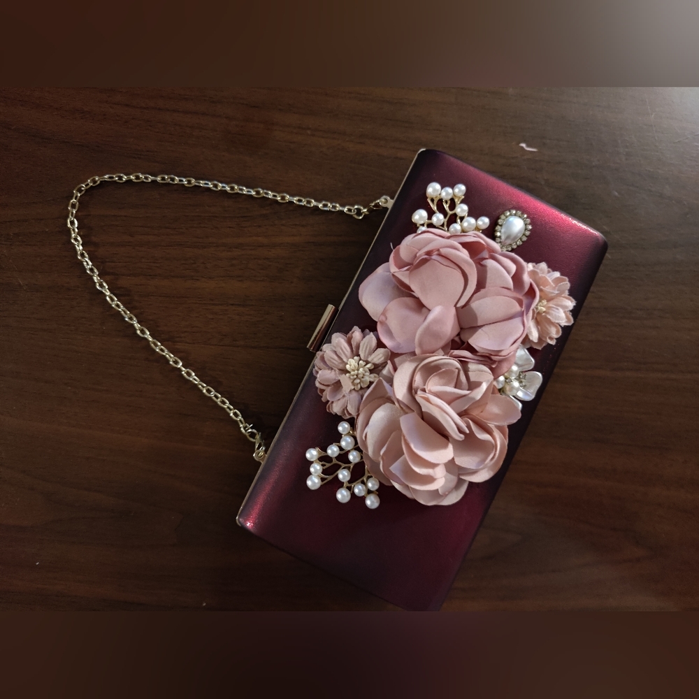 Burgundy convertible clutch bag